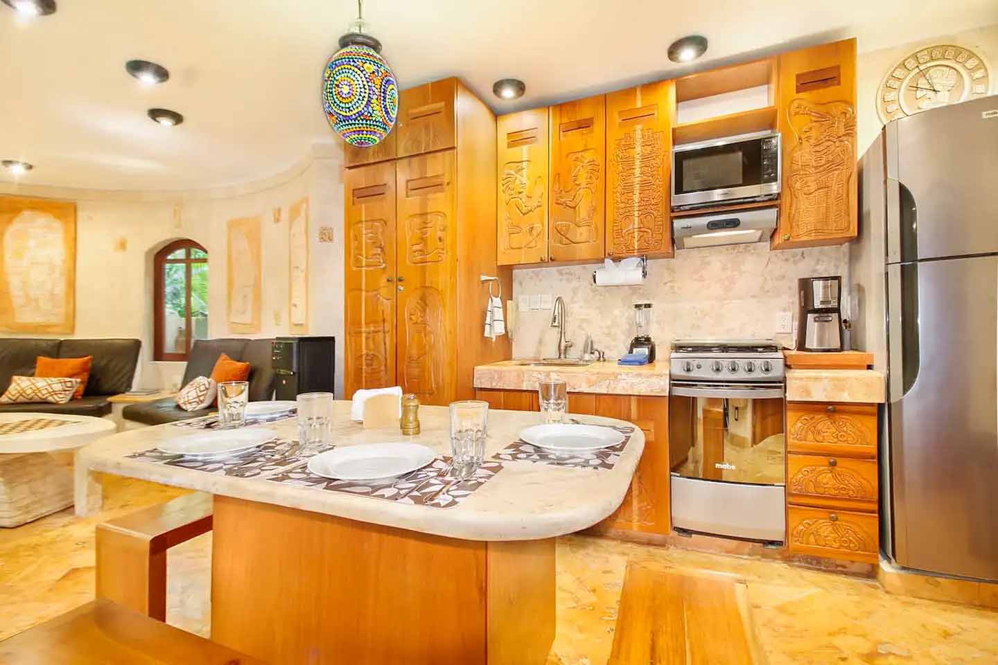 Bedroom detail in Condo 103 highlighting luxury linens and design