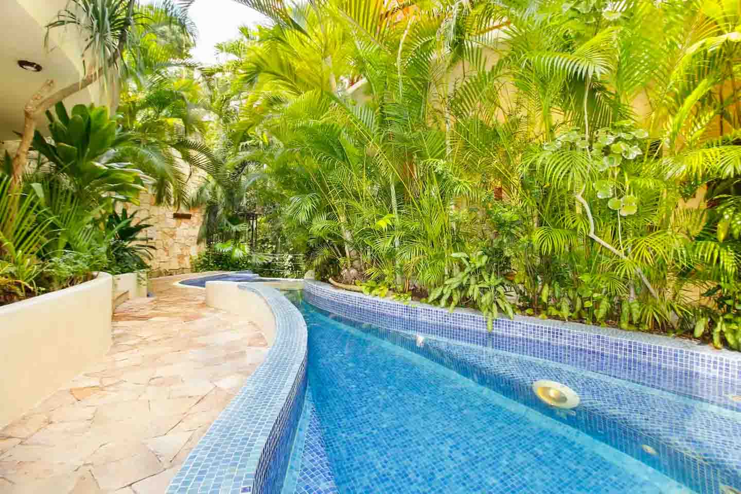 Open-concept kitchen and dining area in Condo 103 with sleek design
